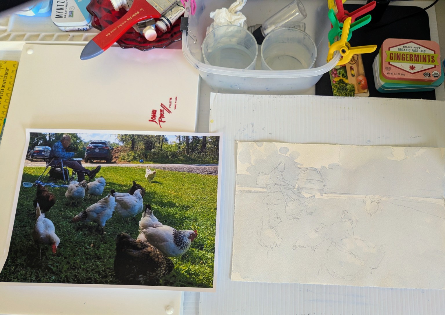 Patty's Cazenovia chicken reference photograph beside the lightly drawn Payne's Gray value study on her work table